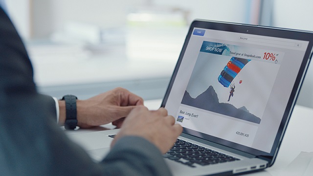 visavue-advertising-640x360 Man using laptop displaying digital advertising.