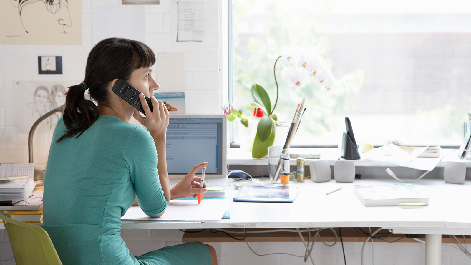 woman-phone-turquoise-dress-1600x900