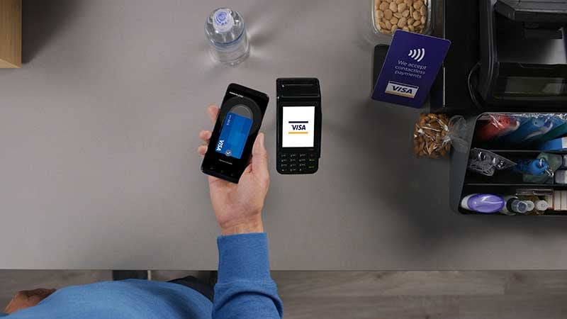 Customer paying his purchase via Samsung pay on his phone.